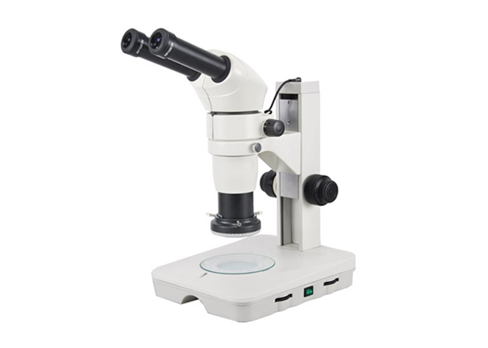 What are the performance advantages of binocular stereomicroscopes?